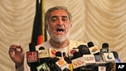 Afghan presidential candidate Abdullah Abdullah speaks during a news conference in Kabul, Afghanistan, May 11, 2014. 