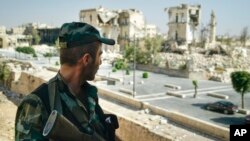 A Syrian soldier guards streets in Aleppo, Syria, Sept. 12, 2017.