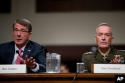 Defense Secretary Ash Carter, left, accompanied by Joint Chiefs Chairman Gen. Joseph Dunford, right, testifies on Capitol Hill in Washington, Sept. 22, 2016, before the Senate Armed Services Committee hearing.