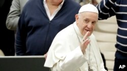 Pope Francis arrives for his weekly general audience, in the Pope Paul VI hall, at the Vatican, Dec. 5, 2018. 