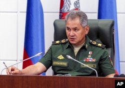 In this photo provided by the Russian Defense Ministry press service, Defense Minister Sergei Shoigu speaks in the headquarters in Moscow, July 28, 2016.