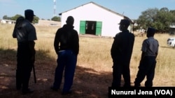 Police seen outside Chief Zvimba's traditional court session in Murombedzi.