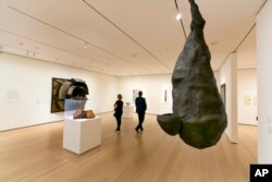 Louise Bourgeois' "The Quartered One," right, hangs in the Robert B. Menschel Gallery at the Museum of Modern Art in New York, June 2, 2017.