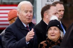 U.S. President Joe Biden gestures after delivering remarks on infrastructure construction projects from the NH 175 bridge across the Pemigewasset River in Woodstock, New Hampshire, November 16, 2021.