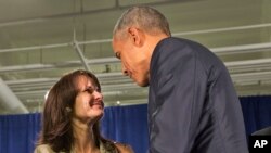 President Barack Obama thanks Crystal Oertle of Shelby, Ohio, for sharing her story of recovery from addiction after they spoke on a panel with others during the National Rx Drug Abuse and Heroin Summit in Atlanta, March 29, 2016.