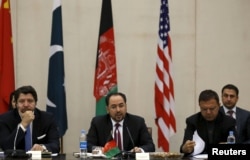 Afghanistan's Foreign Minister Salahuddin Rabbani, center, speaks during a one-day meeting with Pakistan, U.S. and Chinese delegations in Kabul, Jan. 18, 2016. The talks are aimed at ending the country's 15 years of war with the Taliban.