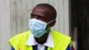 Airport worker in Abidjan wear protection from the spread of the Ebola virus disease in Abidjan, August 12. 