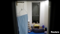 A participant takes a nap inside a cell of Prison Inside Me, a mock prison facility, in Hongcheon, South Korea, November 10, 2018. (REUTERS/Kim Hong-Ji )