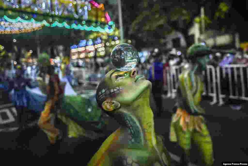 Revelers perform during the Myths and Legends parade in Medellin, Antioquia department, Colombia, Dec. 8, 2021.
