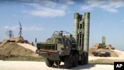 This photo made from the footage taken from the Russian Defense Ministry official web site on Nov. 27, 2015, shows Russian S-400 air defense missiles being deployed at the Hemeimeem air base in Syria.