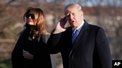 President Trump gestures as he walks across the South Lawn of the White House in Washington with first lady Melania Trump, March 3, 2018, as they return from Trump's Mar-a-Lago estate in Palm Beach, Fla.