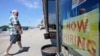 FILE: A man walks into 5th Avenue Deli and Grill, June 4, 2021, in Mayfield Heights, Ohio. 