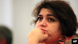 FILE - Azerbaijani Khadija Ismayilova, a reporter for Radio Free Europe/Radio Liberty