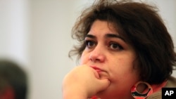 FILE - Azerbaijani Khadija Ismayilova, a reporter for Radio Free Europe/Radio Liberty