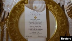 A place setting for the State Dinner for French President Emmanuel Macron is shown in the State Dining Room of the White House in Washington, U.S., April 23, 2018.