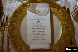 A place setting for the State Dinner for French President Emmanuel Macron is shown in the State Dining Room of the White House in Washington, U.S., April 23, 2018.