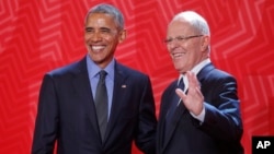 President Barack Obama is welcomed to the Asia-Pacific Economic Cooperation (APEC) by Peru's President Pedro Pablo Kuczynski in Lima, Peru, Nov. 19, 2016.