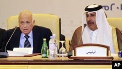Arab League Secretary-General Nabil Elaraby and Qatar's Prime Minister and Foreign Minister Hamad bin Jassim bin Jabr Al-Thani (R) attend a meeting of the Committee of Arab Coordination in Doha (December 2011 file photo)