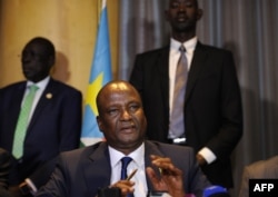 FILE - Newly appointed South Sudan first vice president, Taban Deng Gai (C) speaks during a press conference in Nairobi, Kenya, Aug. 17, 2016.