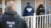 FILE - U.S. Immigration and Customs Enforcement, ICE agents at a home in Atlanta, Georgia.