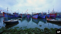 FILE - Fishing boats are docked in Tho Quang port, Danang, Vietnam, March 26, 2016. Fishermen from around the South China Sea tell stories of contending with bandits and coast guards.