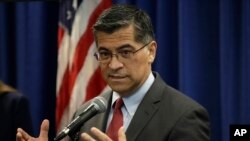 In this Nov. 6, 2019, file photo, California Attorney General Xavier Becerra gestures while speaking at a media conference in San Francisco. (AP Photo/Ben Margot, File)