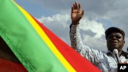 Zimbabwean Prime Minister Morgan Tsvangirai delivers a speech in Chibuku Stadium in Chitungwiza during a rally of his Movement for Democratic Change (MDC) party on November 20, 2011.