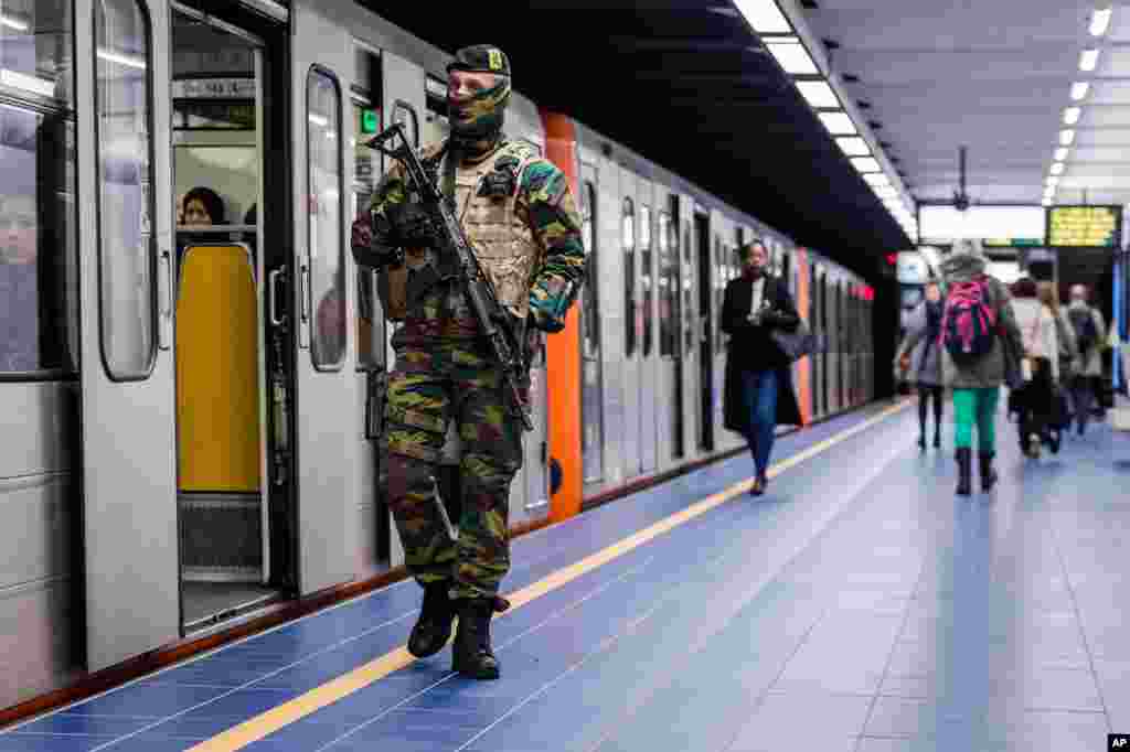 A soldier patrols at Maelbeek metro station in Brussels. For the first time since the March 22 attacks, all of the Brussels metro lines are operating a full schedule again. The Maelbeek station reopened after being closed more &nbsp;than a month due to the terrorist bombing that killed 16 people and wounded many more.