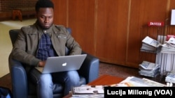 University of Denver international student Kwame Wiredu does some schoolwork on his computer.