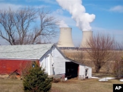 FILE - In this March 16, 2011 file photo, steam is released from Exelon Corp.'s nuclear plant in Byron, Illinois.