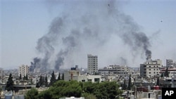 12일 폭격이 계속되는 홈스 시 (유엔 감시단 제공).