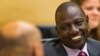 FILE - Kenyan Deputy President William Ruto speaks to his attorney at the International Criminal Court in The Hague, Sept. 10, 2013.