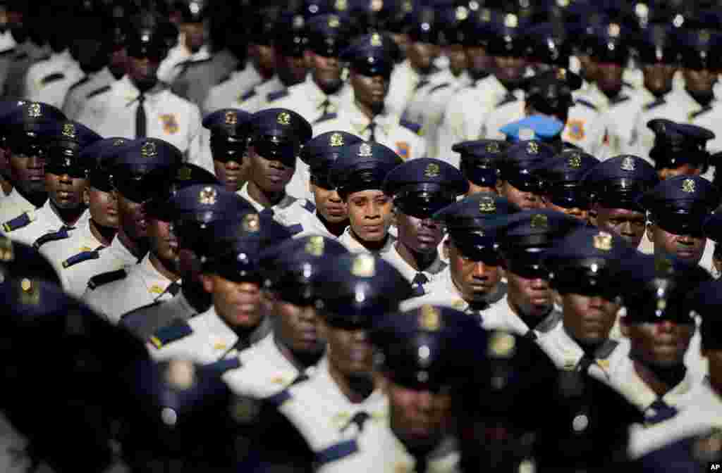 New members of the National Police parade during their graduation ceremony from the Police Academy in Port-au-Prince, Haiti.