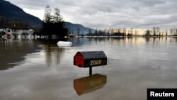 Flood water is seen a week after rainstorms lashed the western Canadian province of British Columbia, triggering landslides and floods, and shutting highways, in Abbottsford, British Columbia, Canada, Nov. 22, 2021.