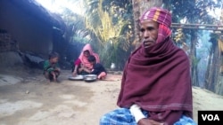 Rohingya Muslim refugee Mohammad Eliyas, with his wife and children, at his Cox's Bazar shanty colony in Bangladesh. With his wife and two children Eliyas fled Myanmar after Burmese soldiers burnt his house, Nov. 2016. (S. Islam for VOA)