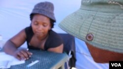 Nurse Nokwezi Dishi counsels a man who’s just tested positive for HIV (D. Taylor/VOA)