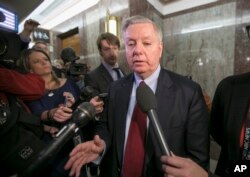 FILE - Sen. Lindsey Graham, R-S.C., speaks to reporters at the Capitol in Washington, Jan. 25, 2018.