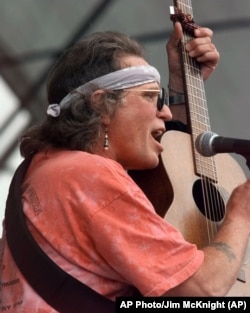 FILE -- Country Joe McDonald performing on Sunday Aug. 15, 1999 at the site of the first Woodstock.