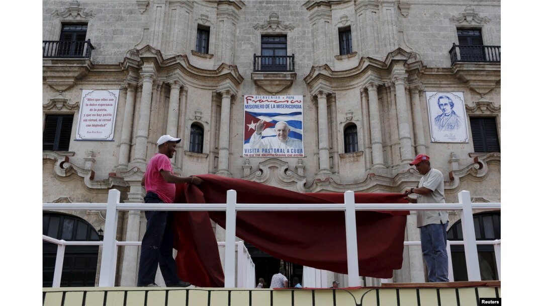 Workers do the final touches to one of the podiums near Havana's cathedral, that will be used during visit of Pope Francis, Cuba, Sept. 17, 2015.