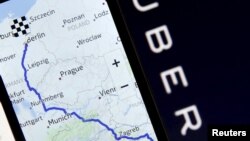 FILE - Nokia Maps is seen on a smartphone in front of a displayed logo of Uber in this May 8, 2015 photo illustration.