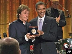 President Barack Obama presents Paul McCartney with the Gershwin Prize for Popular Song at the White House.