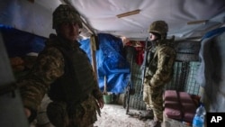 Ukrainian soldiers in a trench shelter on the line of separation from pro-Russian rebels, Mariupol, Donetsk region, Ukraine, Jan. 21, 2022.