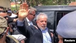 FILE - Former Brazilian President Luiz Inacio Lula da Silva leaves for the cemetery to attend the funeral of his 7-year-old grandson, in Sao Bernardo do Campo, Brazil, March 2, 2019. 