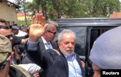 FILE - Former Brazilian President Luiz Inacio Lula da Silva leaves for the cemetery to attend the funeral of his 7-year-old grandson, in Sao Bernardo do Campo, Brazil, March 2, 2019.