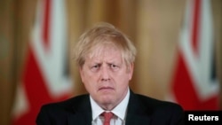 英國首相約翰遜2020年3月20日就新冠病毒疫情古董記者會（路透社）