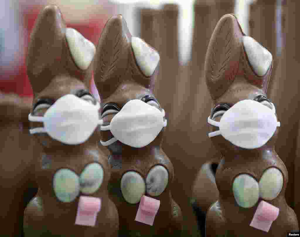Chocolate Easter Bunnies with a protective mask and a roll of toilet paper are seen at a chocolate factory in Pirmasens, Germany.