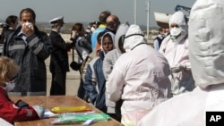 Rescued migrants arrive at the southern Italian port of Corigliano, Italy, April 15, 2015.