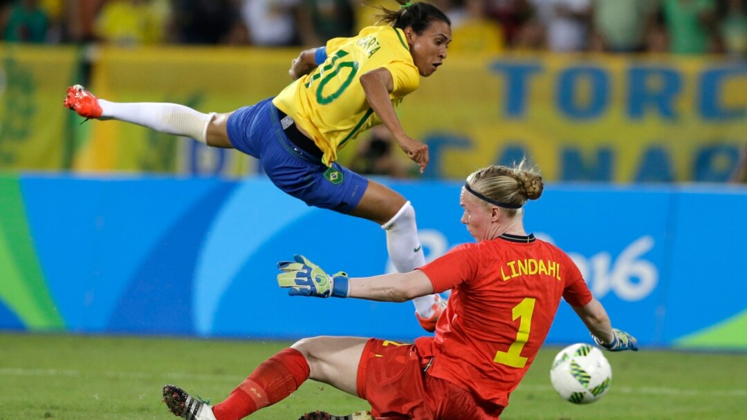 Brazil's Marta holds a Brazil's national jersey before making