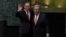 United Nations Secretary-General Ban Ki-moon (left) and Secretary-General-designate Antonio Guterres stand together after the swearing-in ceremony at UN headquarters in New York, Dec. 12, 2016. 