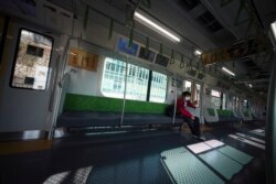 A man with protective mask rides an empty train Wednesday, April 8, 2020, in Tokyo. Japanese Prime Minister Shinzo Abe declared a state of emergency yesterday for Tokyo and six other prefectures. (AP)